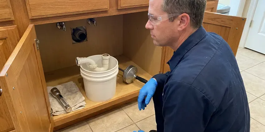 DFM Plumbing technician providing tankless water heater repair in Jackson